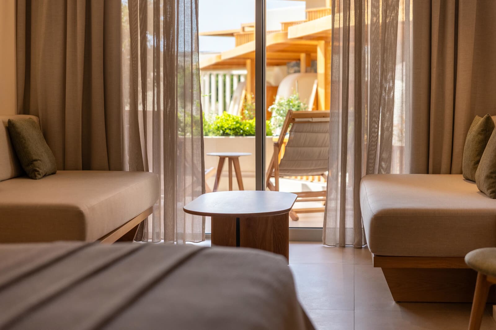  Ample natural light streams in through the floor-to-ceiling glass door, enhancing the bright, airy feel.